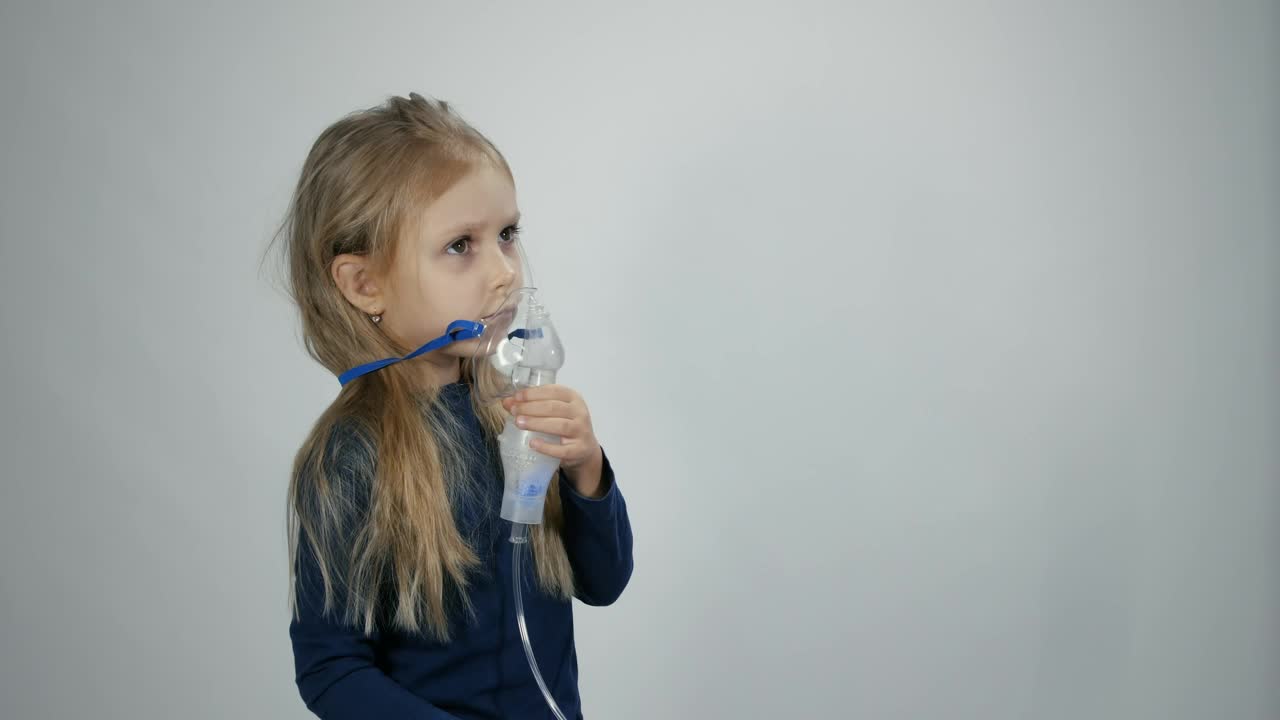 Stock Video Little Girl Breathing With Inhalation Device Animated Wallpaper - Free Download