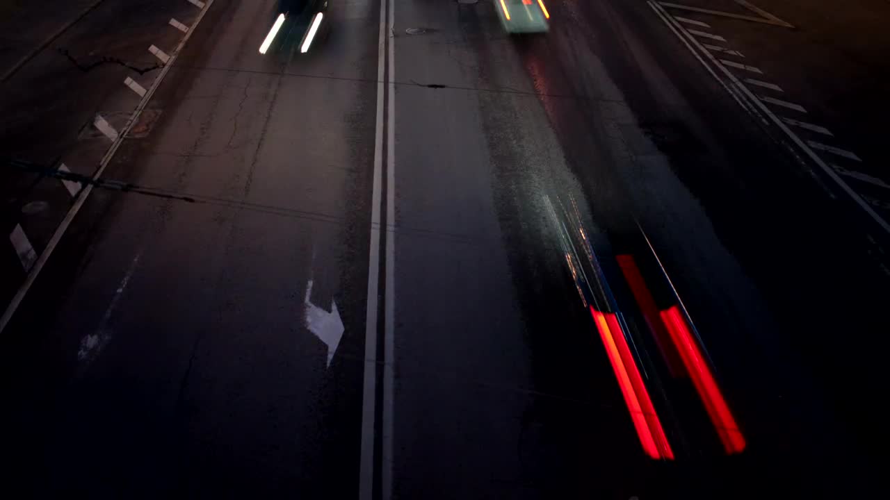 Free Video Stock traffic heading in two directions at night Live Wallpaper - Free Download