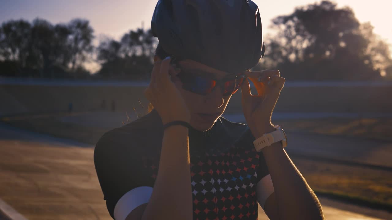 Stock Video Female Cyclist Putting On Sunglasses Before Training Live Wallpaper For PC - Free Download