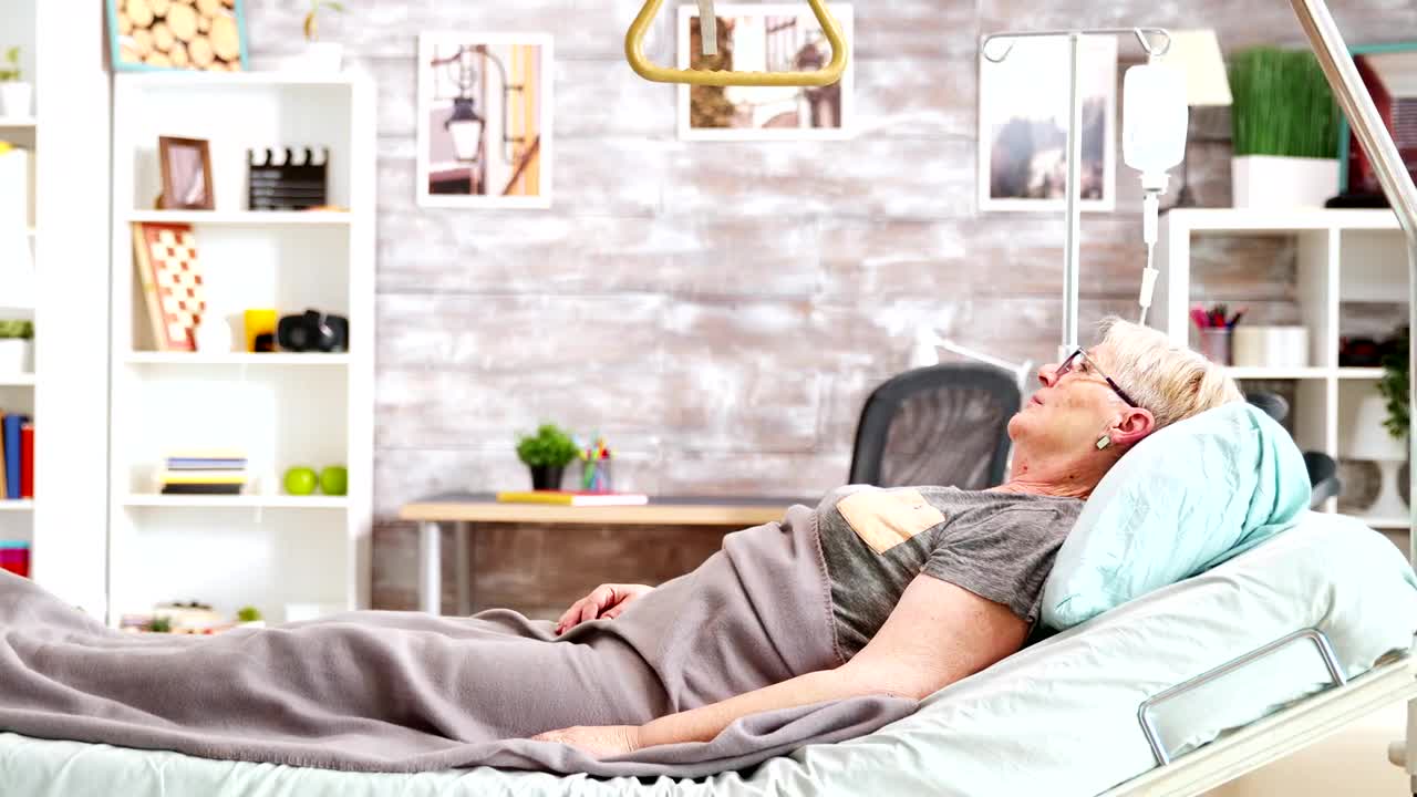 Stock Video Elderly Woman Laying On Bed In Nursing Home Live Wallpaper For PC - Free Download