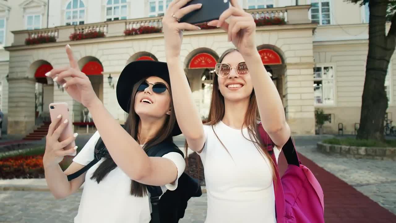 Stock Video Beautiful Tourists Pose For Social Media In European Town Live Wallpaper For PC - Free Download