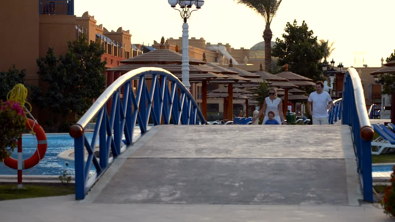 Stock Video Happy Family Running Across A Bridge Animated Wallpaper - Free Download