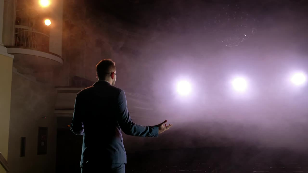 Free Video Stock Successful Speaker Practicing On An Empty Stage Live Wallpaper - Free Download