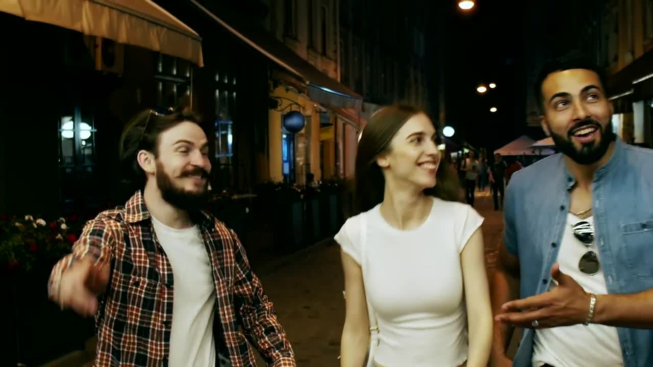 Stock Video Friends Laugh And Walk Down City Street At Night Live Wallpaper For PC - Free Download