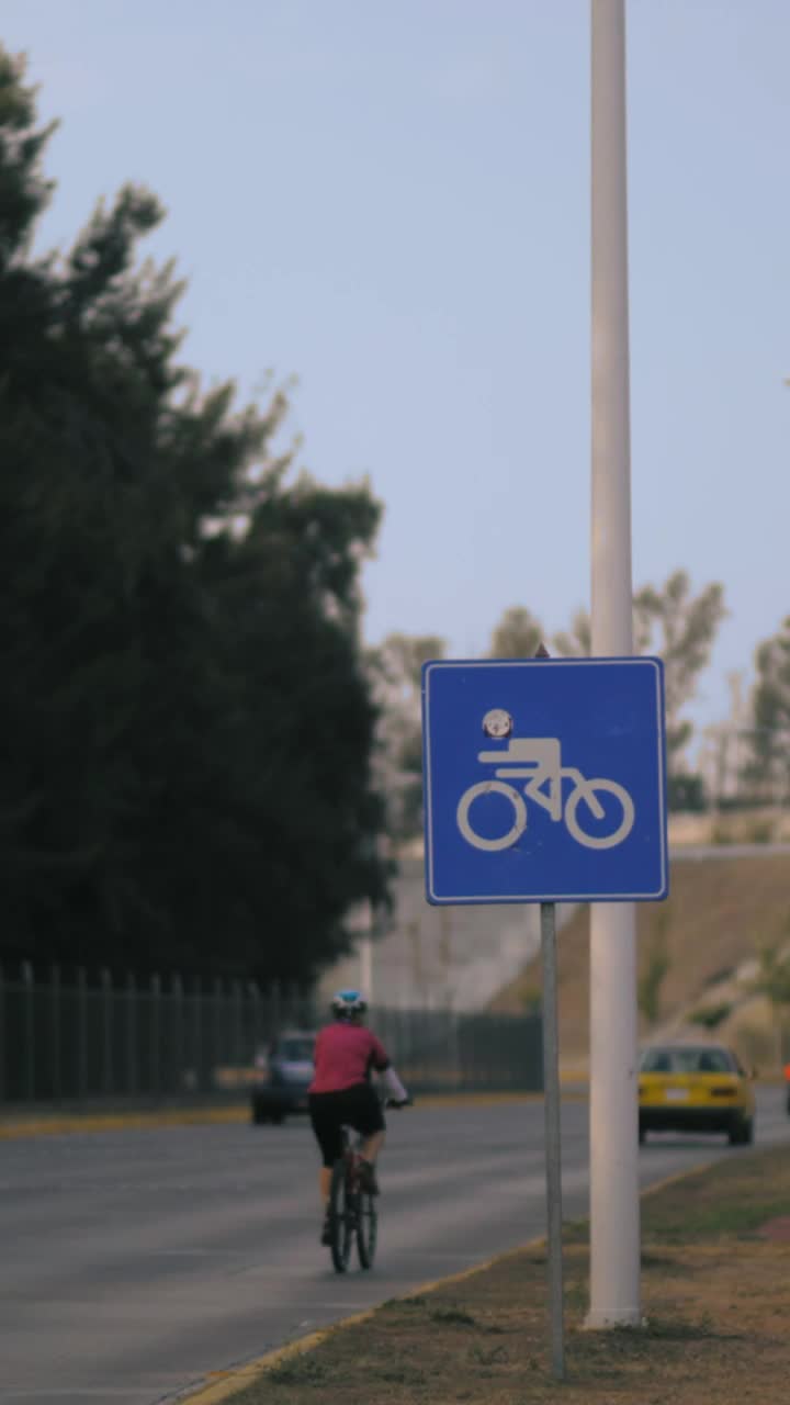 Stock Video Cyclist Sign Next To A Road Vertical Shot Live Wallpaper For PC - Free Download