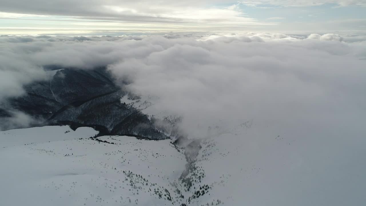 Free Video Stock Snowy Relief Covered By Clouds From Above Live Wallpaper - Free Download