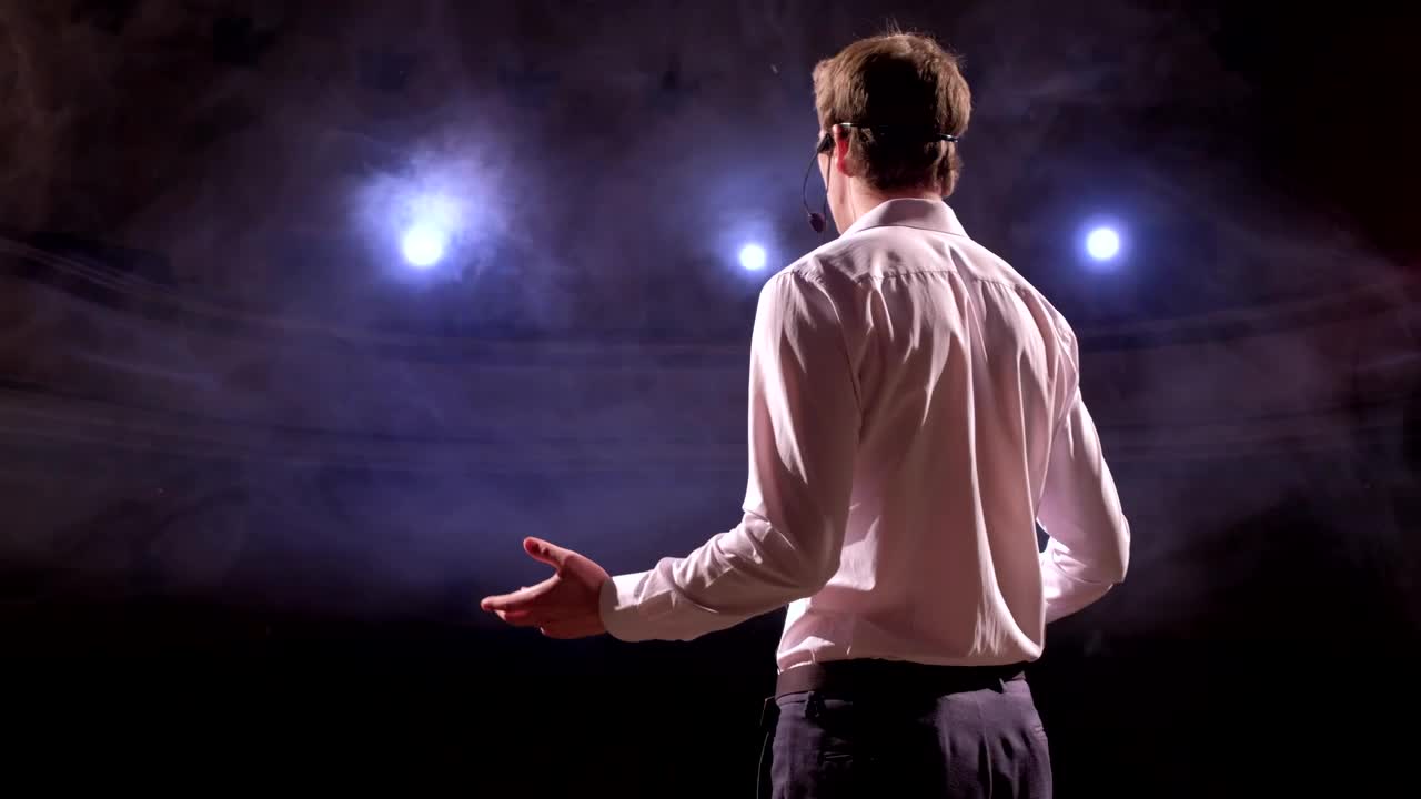 Free Video Stock Speaker Gives A Talk In An Auditorium Live Wallpaper - Free Download
