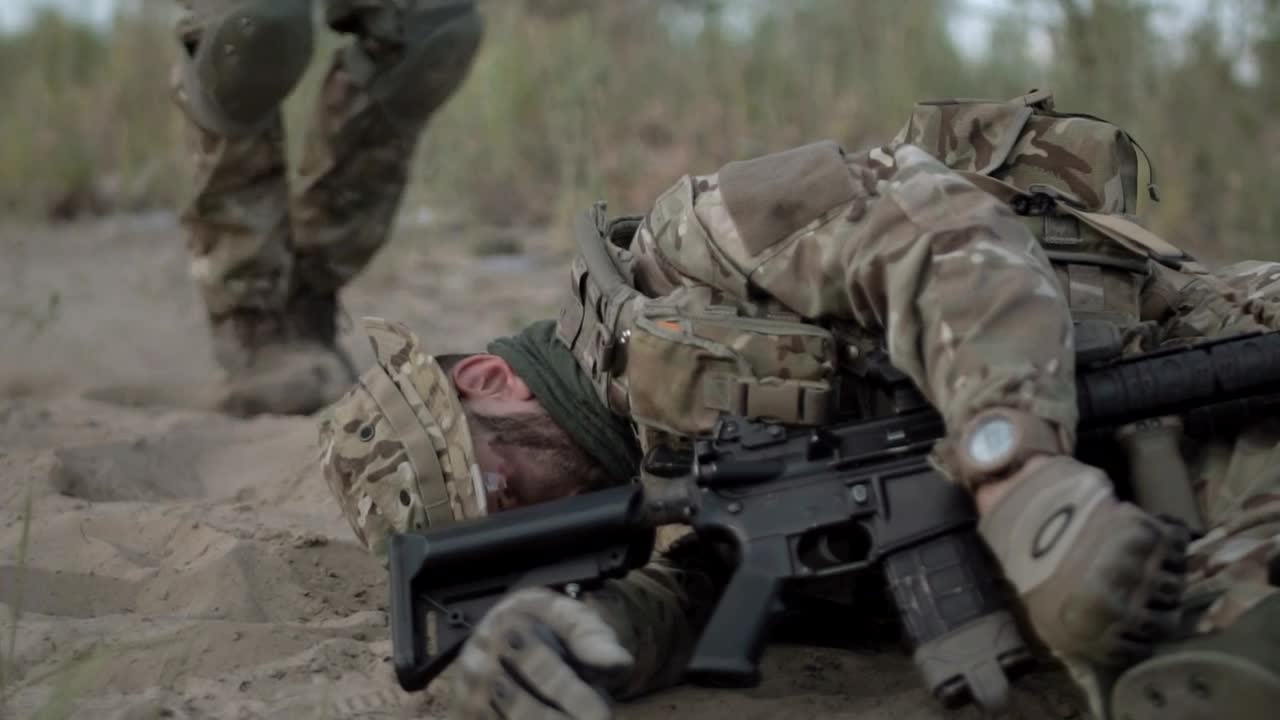 Stock Video Helping A Wounded Soldier In The Battlefield Animated Wallpaper - Free Download