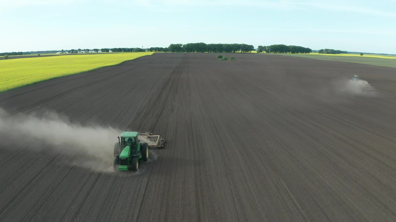 Free Video Stock tractor driving along a dusty field Live Wallpaper - Free Download