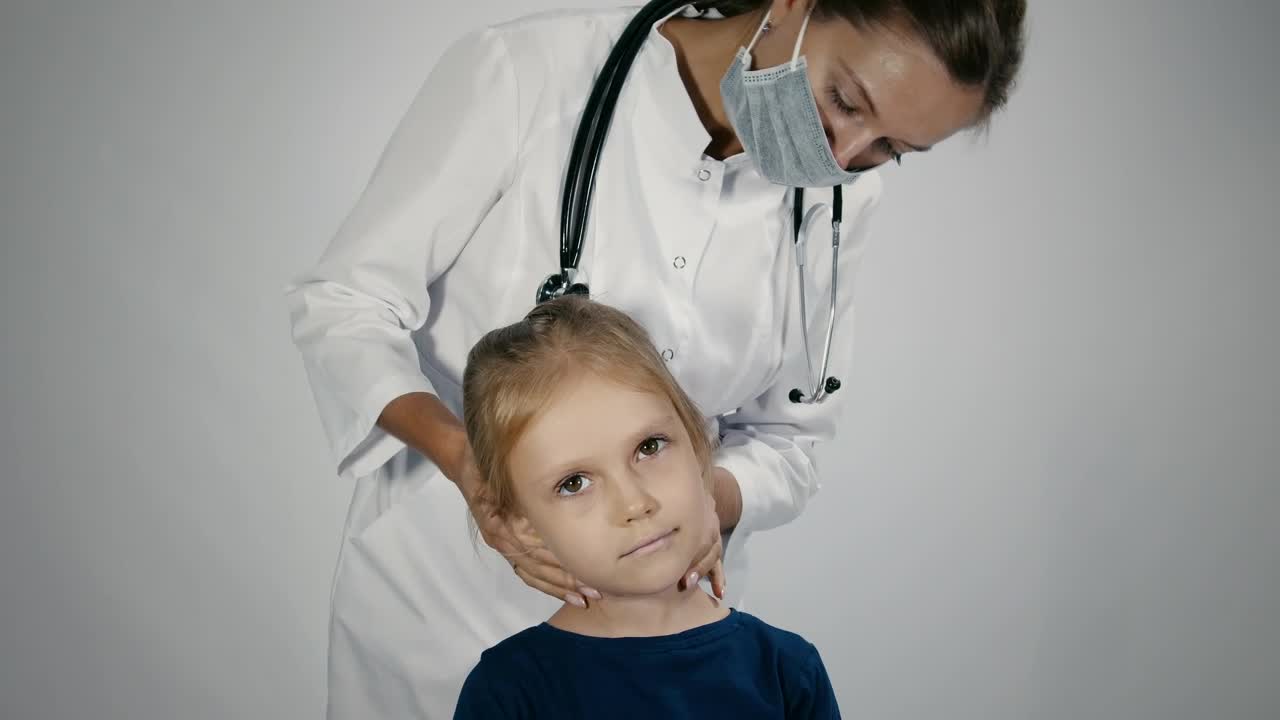 Stock Video Female Doctor Checking The Lymph Node Of The Child Live Wallpaper For PC - Free Download