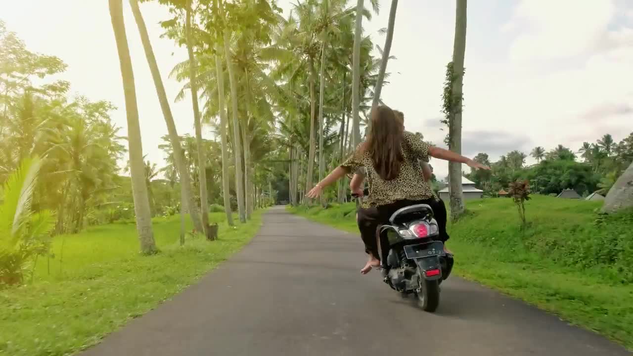 Stock Video Happy Couple In A Funny Trip On Motorcycle Animated Wallpaper - Free Download