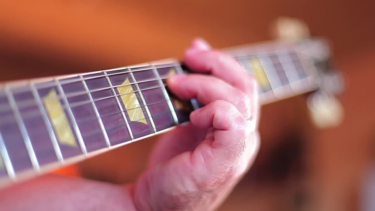 Stock Video Hand Of A Man Playing Chords On A Guitar Live Wallpaper For PC - Free Download