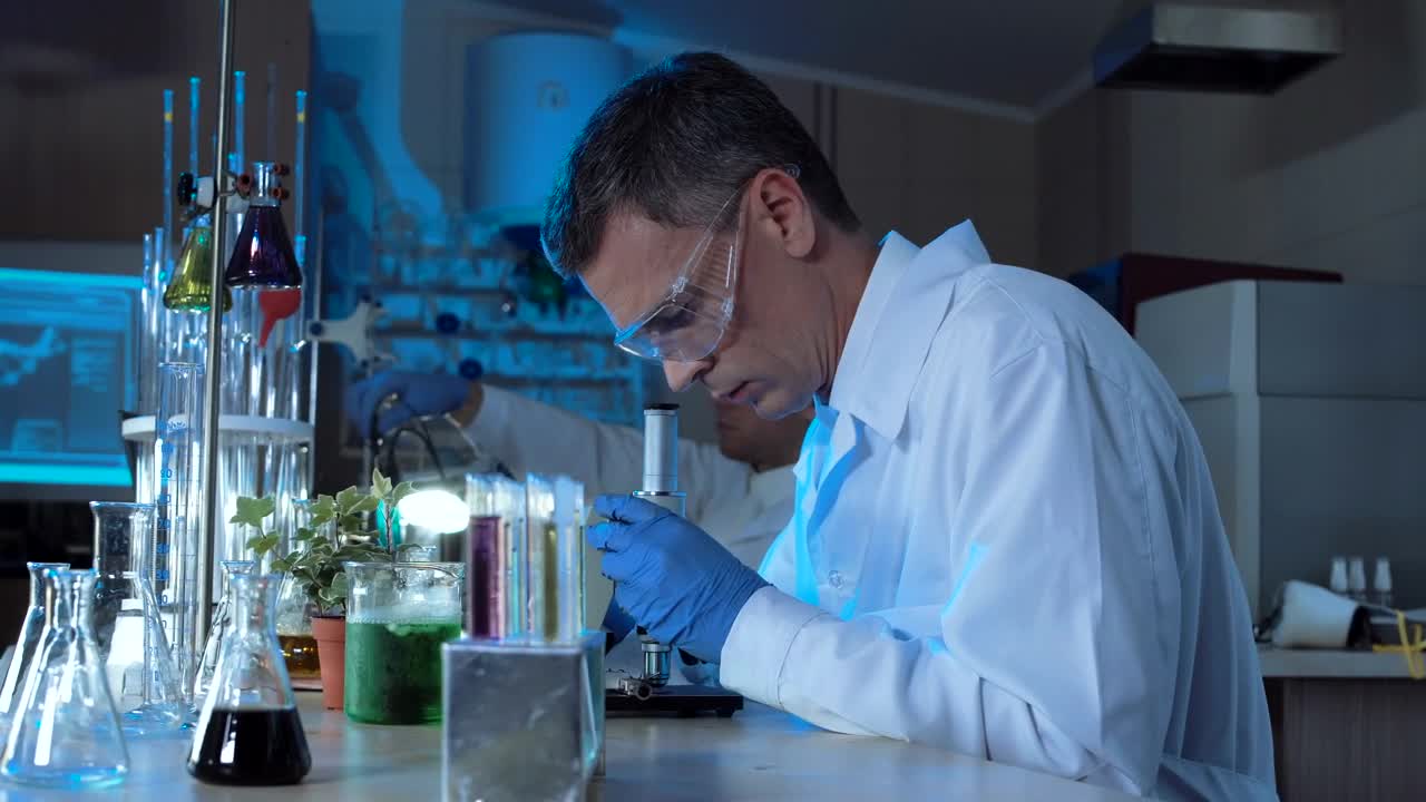 Free Stock Video Scientist Working With A Microscope In The Lab Live Wallpaper - Free Download