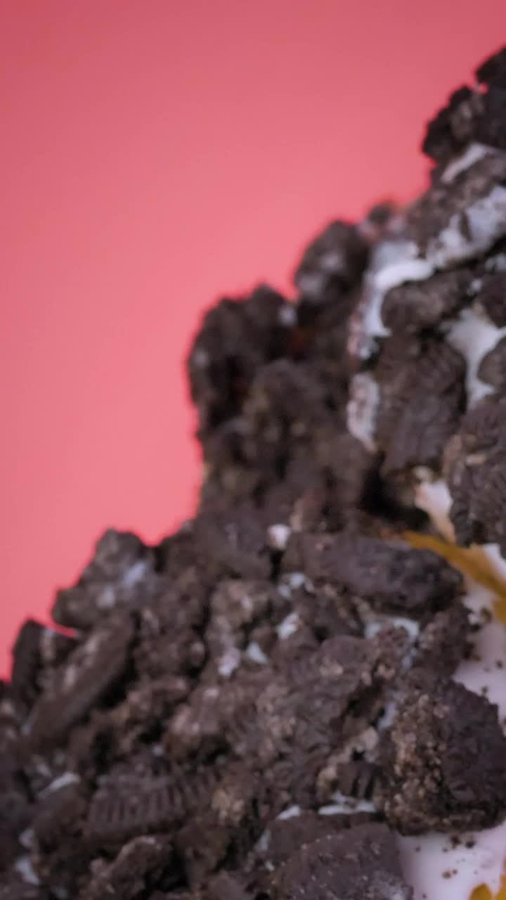 Free Video Stock Stacking Donuts With Cookie Pieces On A Pink Background Live Wallpaper - Free Download