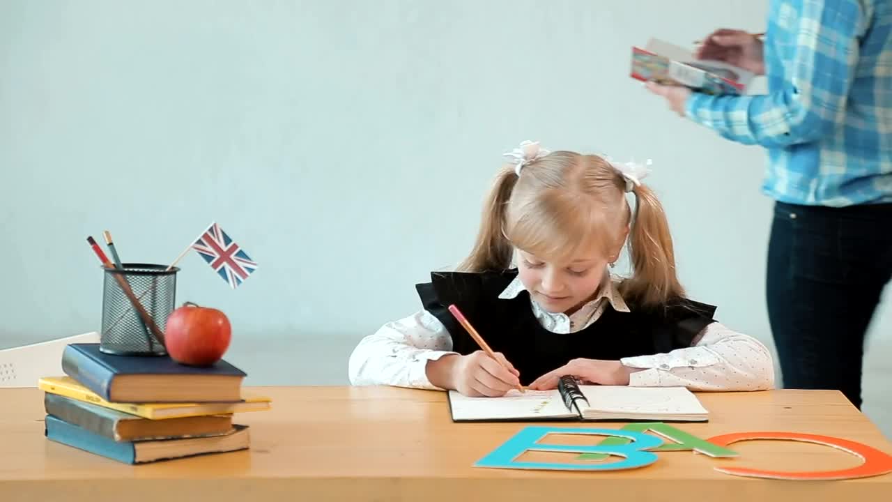 Stock Video Little Girl Studying For Her Exam With Her Teacher Animated Wallpaper - Free Download