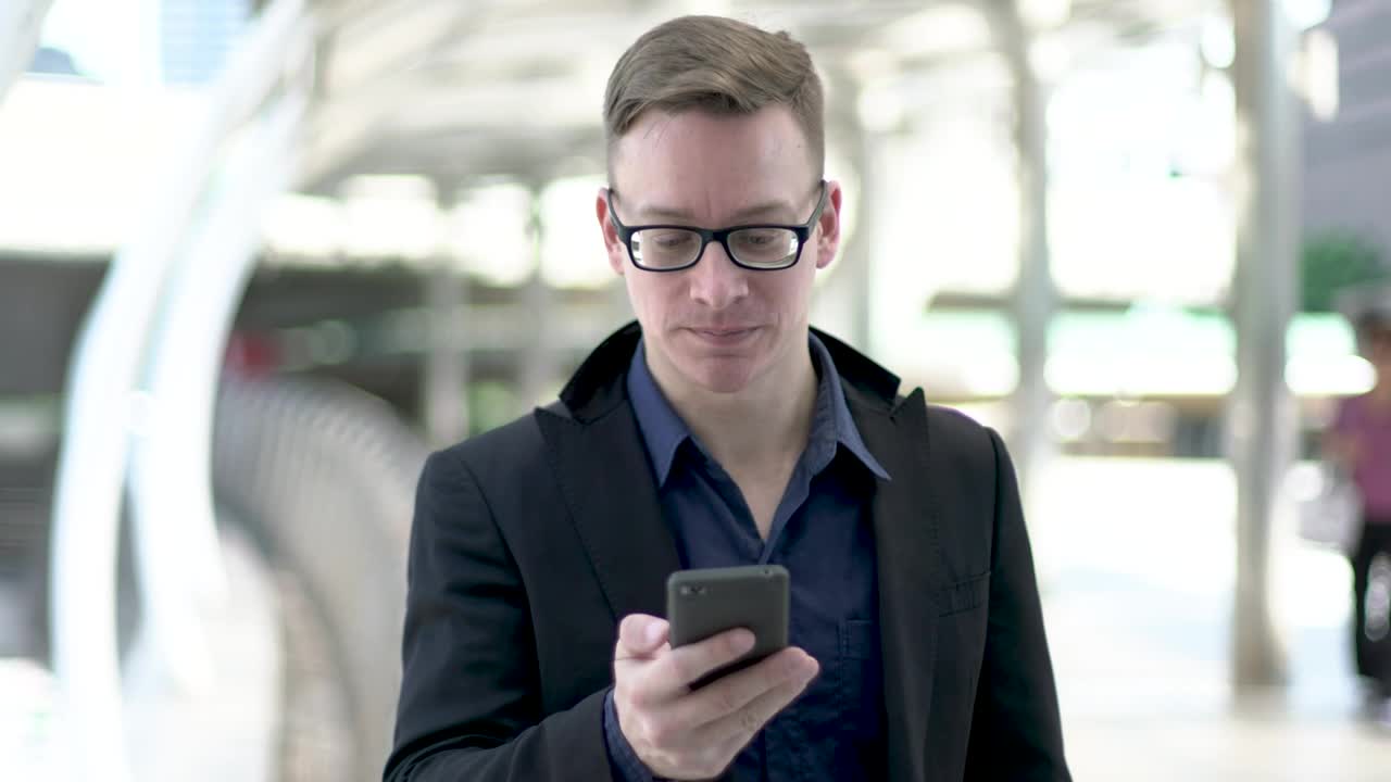 Stock Video Entrepreneur Young Man Wearing Glasses On A Call Live Wallpaper For PC - Free Download