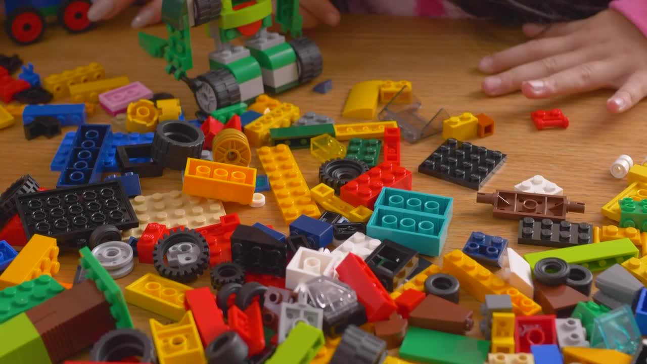 Stock Video Mother And Daughter Playing With Lego Brick Animated Wallpaper - Free Download