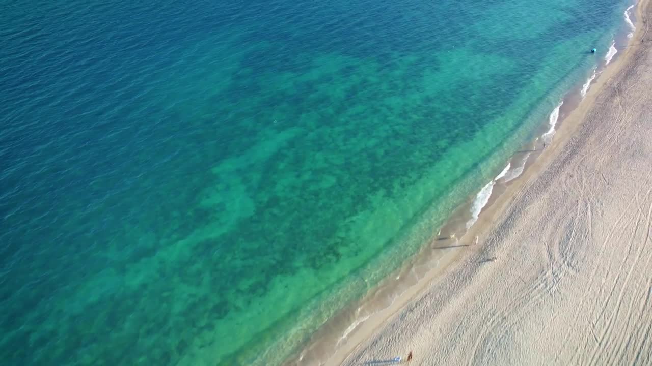 Stock Video Flying Over A Peaceful And Sunny Beach Live Wallpaper For PC - Free Download