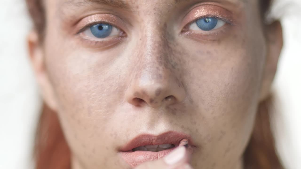Stock Video Face Of A Woman Putting On Lip Makeup Live Wallpaper For PC - Free Download