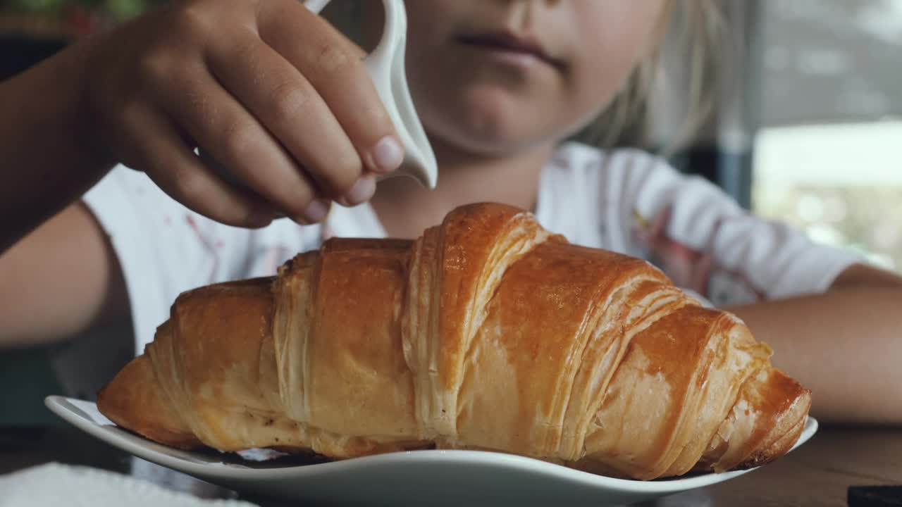 Stock Video Girl Adding Sweet Milk On A Croissant Live Wallpaper For PC - Free Download