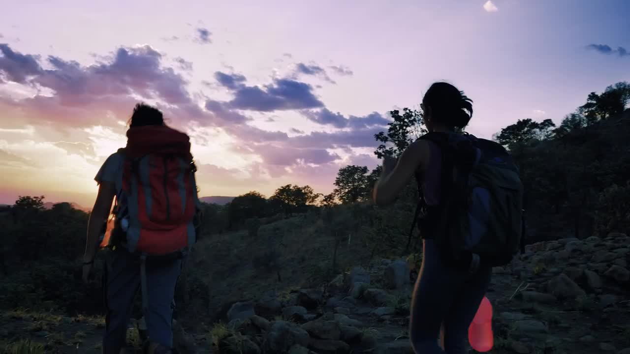 Stock Video Pair Of Mountaineers Leaving Through Nature At Sunset Live Wallpaper - Free Download