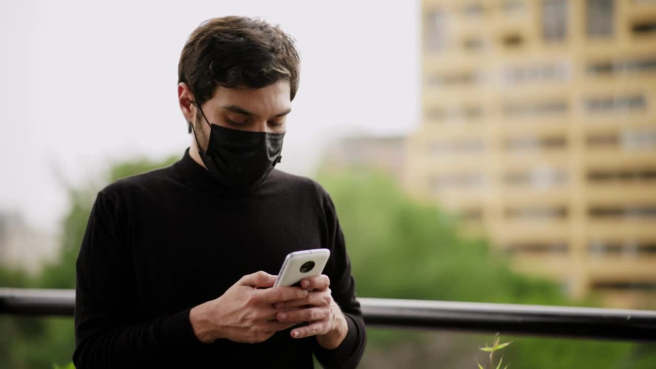 Stock Video Man With Face Mask Sending Audios By Cell Phon Animated Wallpaper - Free Download