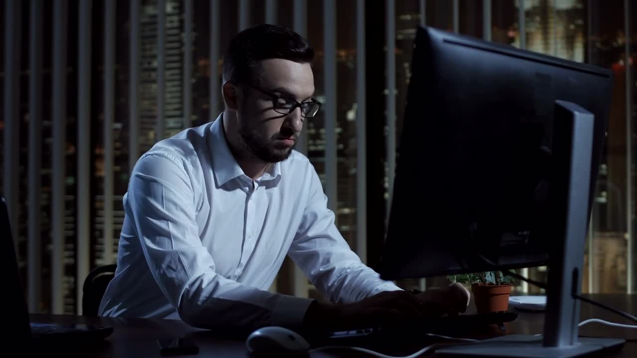 Stock Video Focused Businessman Working Late At Night Live Wallpaper For PC - Free Download