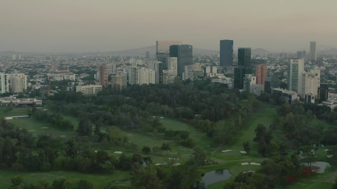 Stock Video Flying Over A Large Park Surrounded By A Metropolis Live Wallpaper For PC - Free Download