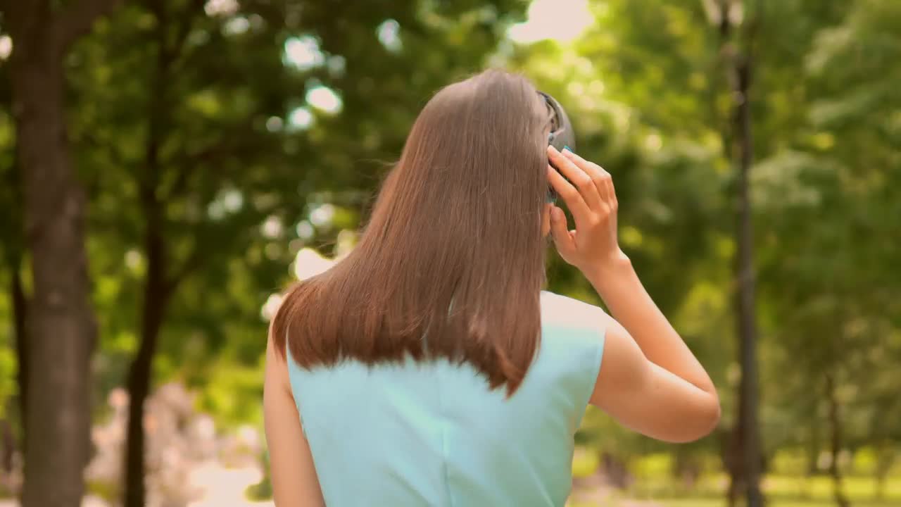 Stock Video Girl Walking In Nature With Music On Her Headphones Live Wallpaper For PC - Free Download