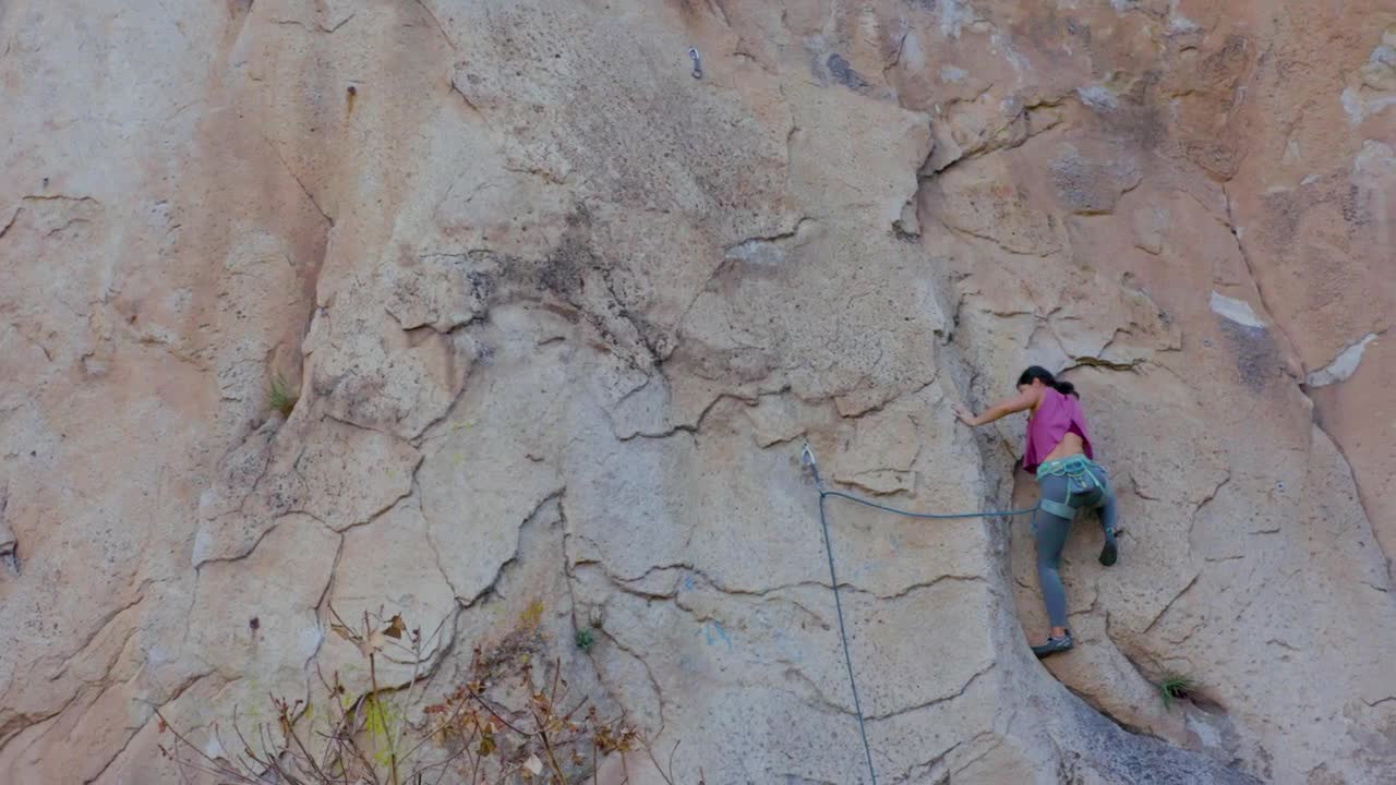 Stock Video Experienced Female Mountaineer Climbing A Vertical Mountain Live Wallpaper For PC - Free Download