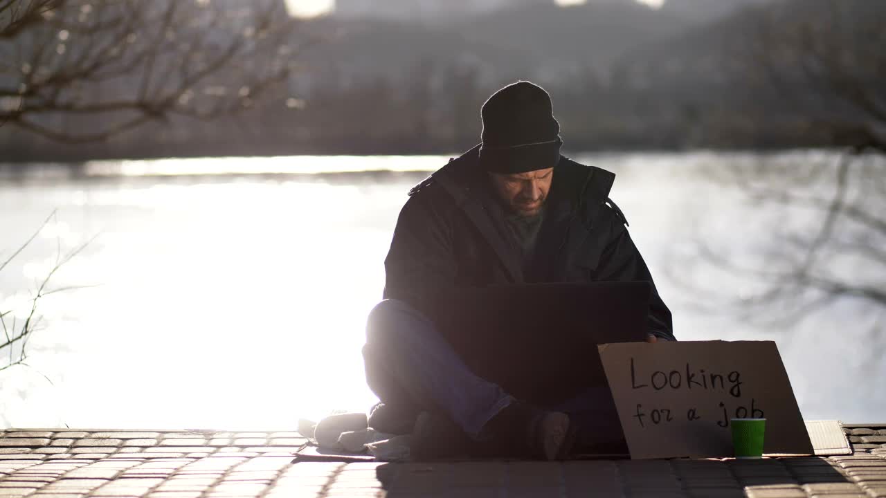 Stock Video Homeless With A Cardboard Sign Looking For A Job Animated Wallpaper - Free Download