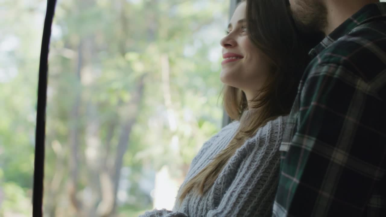 Stock Video Loving Couple Embracing In Front Of The Window Animated Wallpaper - Free Download