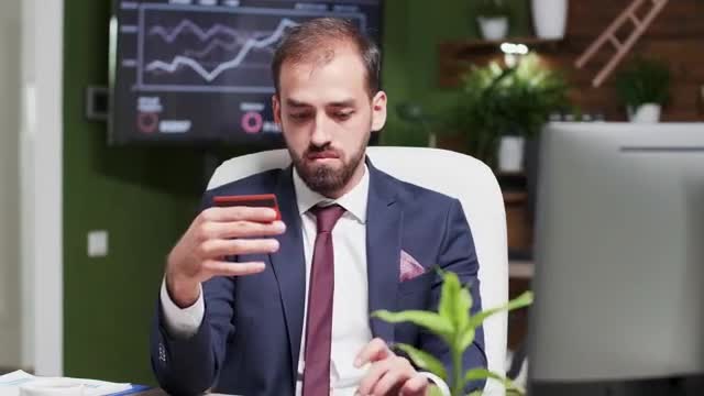 Video Stock Businessman Online Shopping In Office Holds Credit Card Smal Live Wallpaper For PC - Free Download