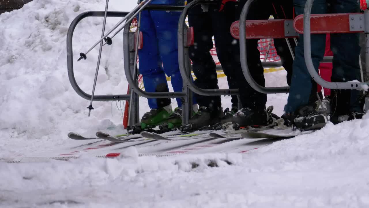 Free Video Stock Skiers Passing Turnstile Gate Of Ski Lift Entrance Live Wallpaper - Free Download