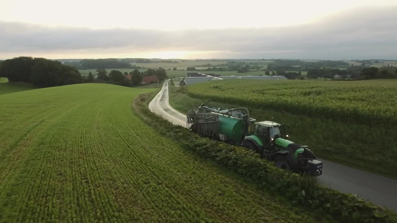 Free Video Stock tractor driving on a country road Live Wallpaper - Free Download