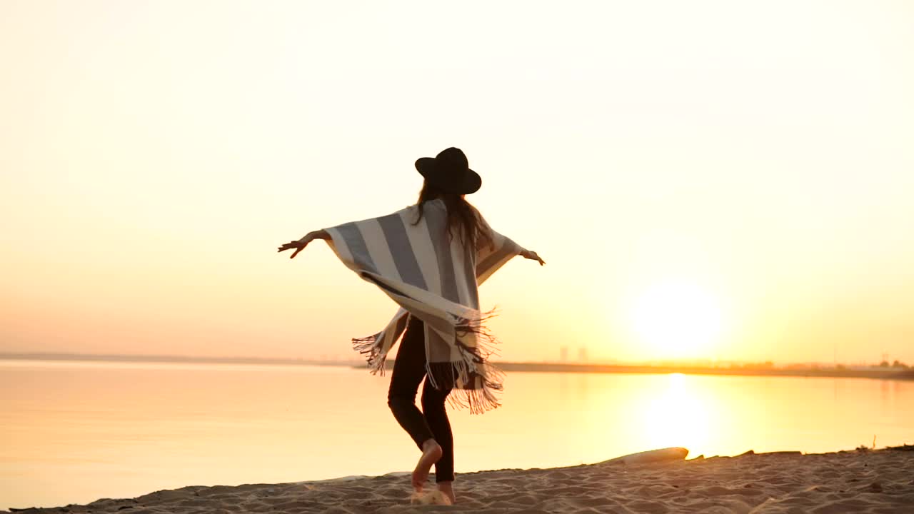 Free Video Stock Stylish Millennial Woman Spins On Beach At Sunset Live Wallpaper - Free Download
