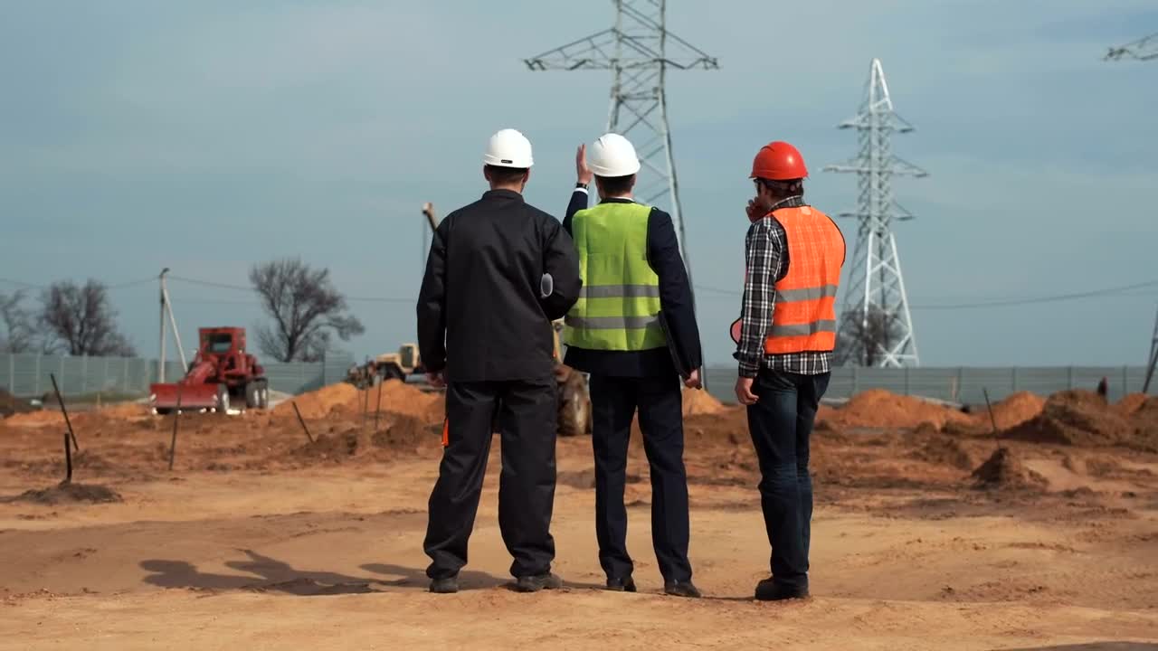 Stock Video Engineers Talking In Front Of The Electrical Towers Live Wallpaper For PC - Free Download
