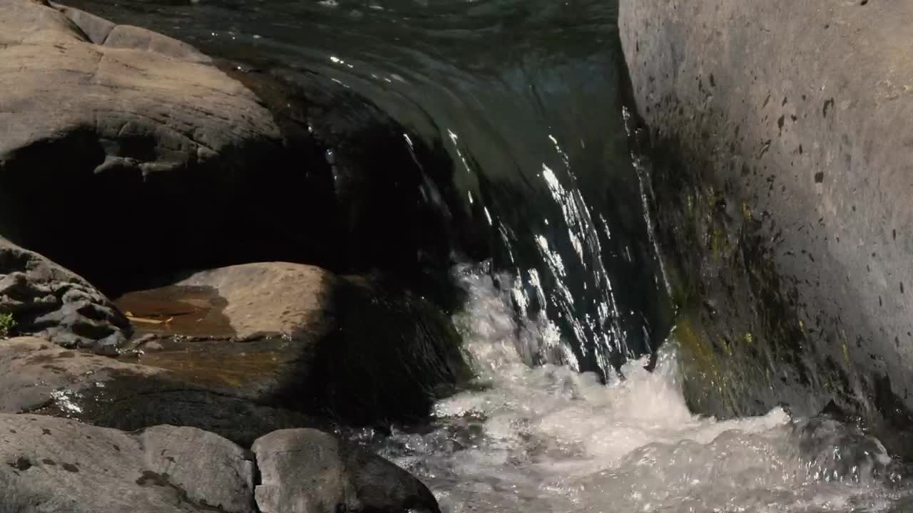 Stock Footage Water Falls Between Rocks Live Wallpaper - Free Download