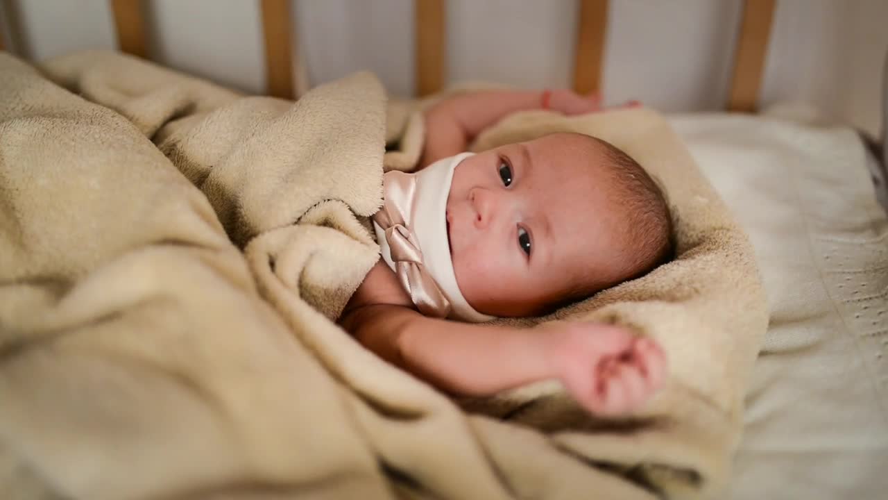 Stock Video Female Newborn Baby Lying In Her Crib Live Wallpaper For PC - Free Download