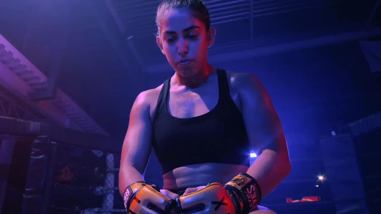 Stock Video Mixed Martial Arts Fighter Sitting In A Rin Animated Wallpaper - Free Download