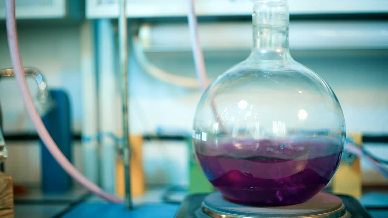Stock Video Flask Of Boiling Purple Liquid In A Lab Live Wallpaper For PC - Free Download