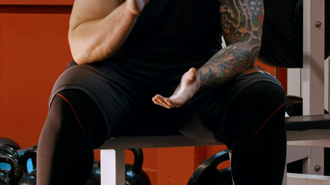 Stock Video Man With A Tattoo Clapping His Hand Animated Wallpaper - Free Download