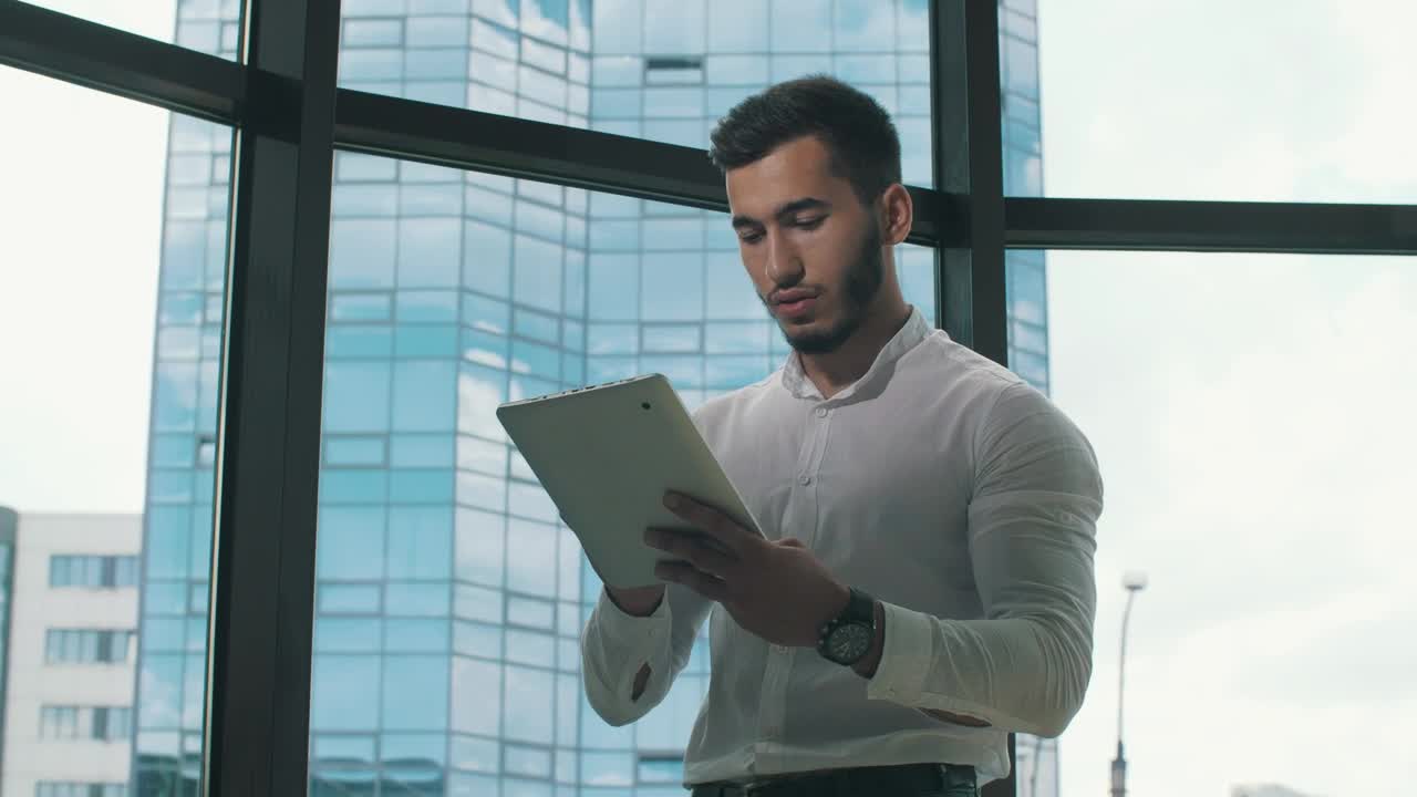 Stock Video Entrepreneur Working On A Tablet In His Office Live Wallpaper For PC - Free Download