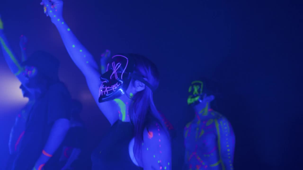 Stock Video People Dancing With Neon Masks In The Dark Live Wallpaper - Free Download