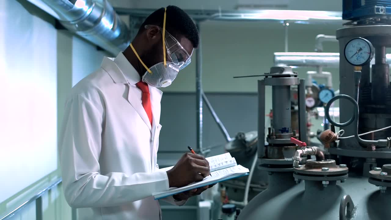 Free Stock Video Scientist In Facemask Writing In A Chemical Lab Live Wallpaper - Free Download