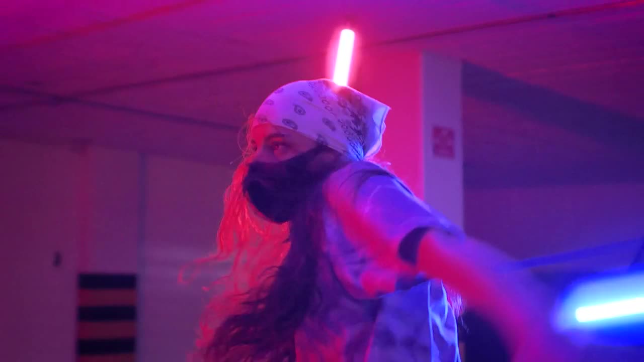 Stock Video Girl And Boy With Masks Dancing Under Colored Lights Live Wallpaper For PC - Free Download