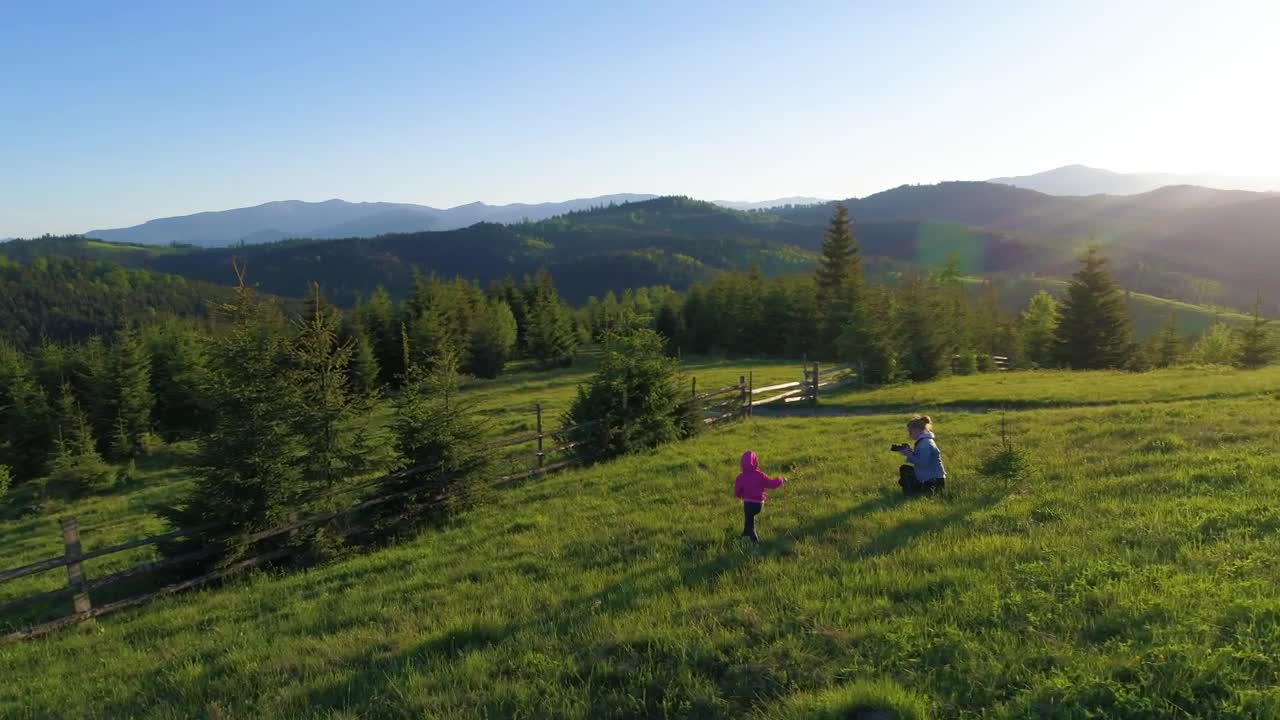 Stock Video Little Girl Plays With Her Mother In The Meadow Animated Wallpaper - Free Download