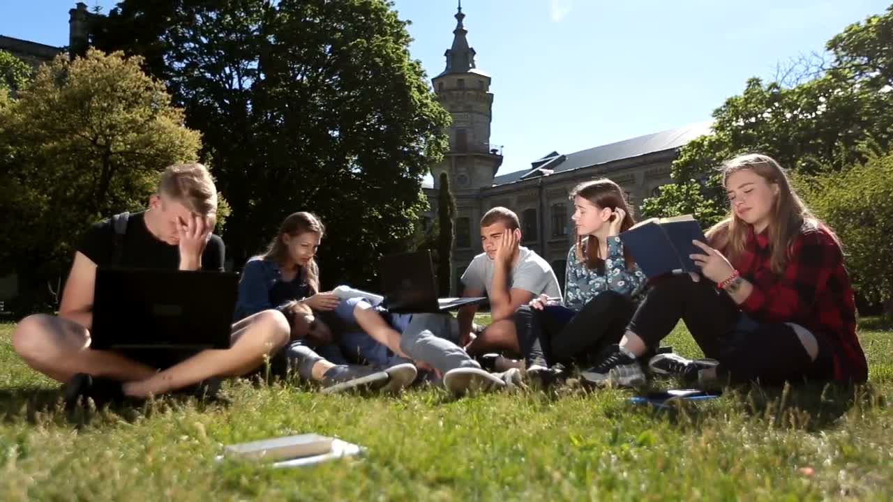 Stock Video Exhausted Classmates Studying In A School Garden Live Wallpaper For PC - Free Download