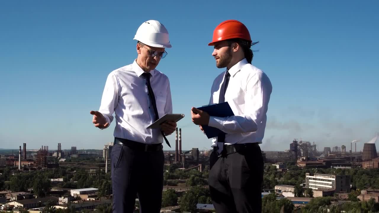 Stock Video Engineers Discussing Project Outdoors Live Wallpaper For PC - Free Download