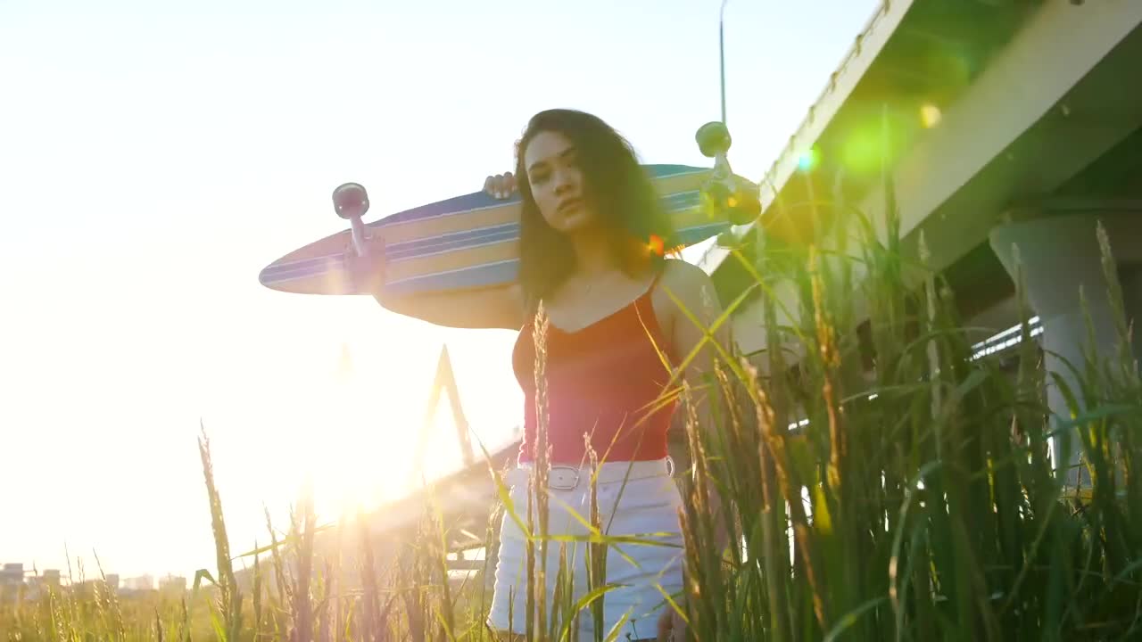Free Stock Video Woman With A Skateboard Under Sunset Light Live Wallpaper - Free Download